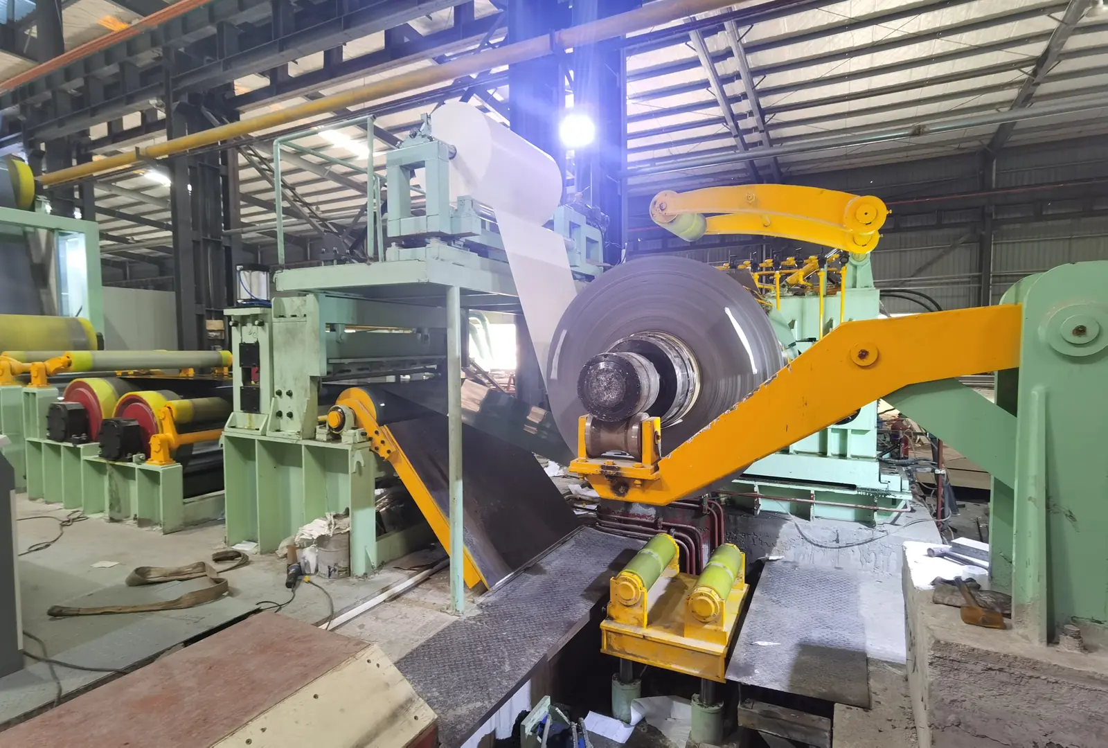 Advanced steel rolling mill machine in operation with metal coil processing